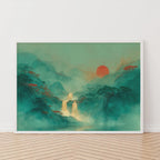 Framed artwork of a asian mountain landscape with a red sun on a white wall.