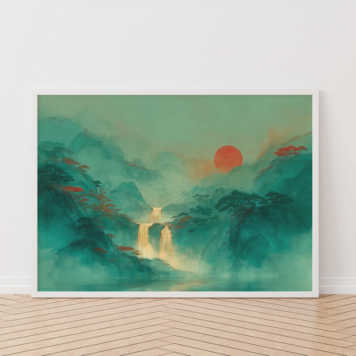 Framed artwork of a asian mountain landscape with a red sun on a white wall.