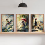 Three framed artworks on a wall shelf with a lamp and plants in the background.