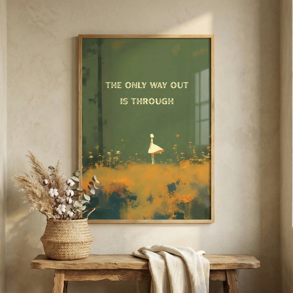 A framed art print with the quote 'THE ONLY WAY OUT IS THROUGH' hangs on a textured beige wall above a rustic wooden bench. The print features a dark green background with a small white figure walking through an orange and yellow field.