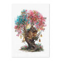 A vertical art print featuring a whimsical watercolor illustration of a treehouse nestled within a flowering tree. The tree has pink blossoms on one side and blue blossoms on the other, with glowing lanterns hanging from the branches and a small wooden house built into the trunk.