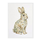 A vertical art print featuring a watercolor-style rabbit seated on a white background, with the rabbit's body filled with botanical leaf and flower illustrations in muted green, beige, and brown tones.