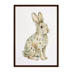 Framed art print featuring a watercolor-style rabbit filled with botanical leaf and flower patterns, set in a dark brown frame against a white background.
