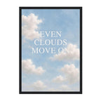 A framed art print featuring the text 'EVEN CLOUDS MOVE ON' in white serif letters over a soft blue sky with white clouds, set against a clean white background.