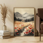 Framed artwork of a landscape with red poppy flowers on a wall in a room with a chair and decor items.