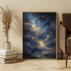 Framed artwork of a celestial scene in a living room setting with a chair and decor items.