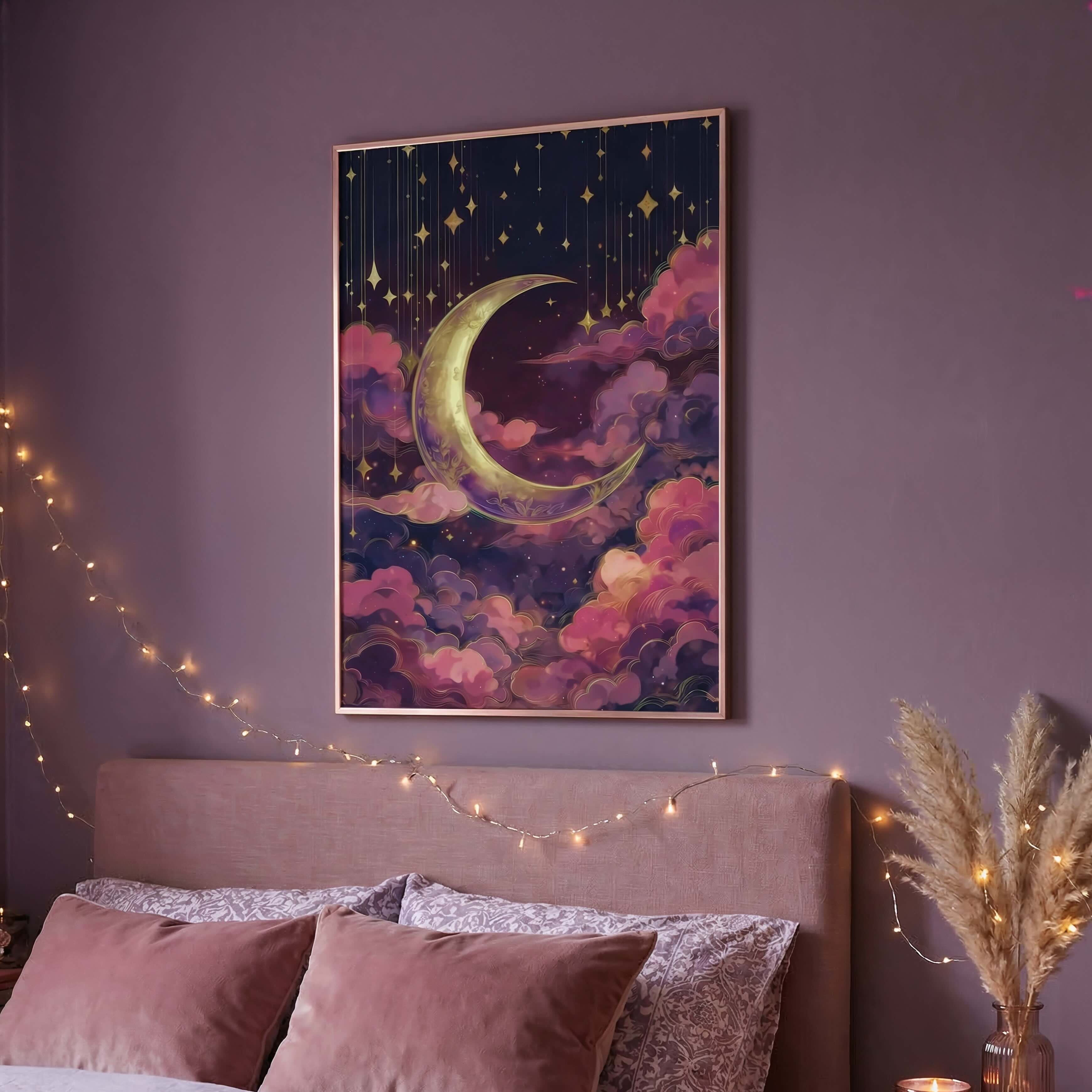 A framed wall art print featuring a crescent moon and stars in a dreamy purple, pink, and navy sky, displayed above a bed in a cozy bedroom setting with string lights and candles.